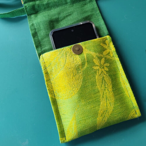 Phone pocket secured with magnetic snap