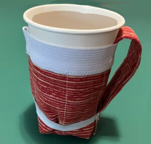 Snap-in water-bottle holder as a drink cozy